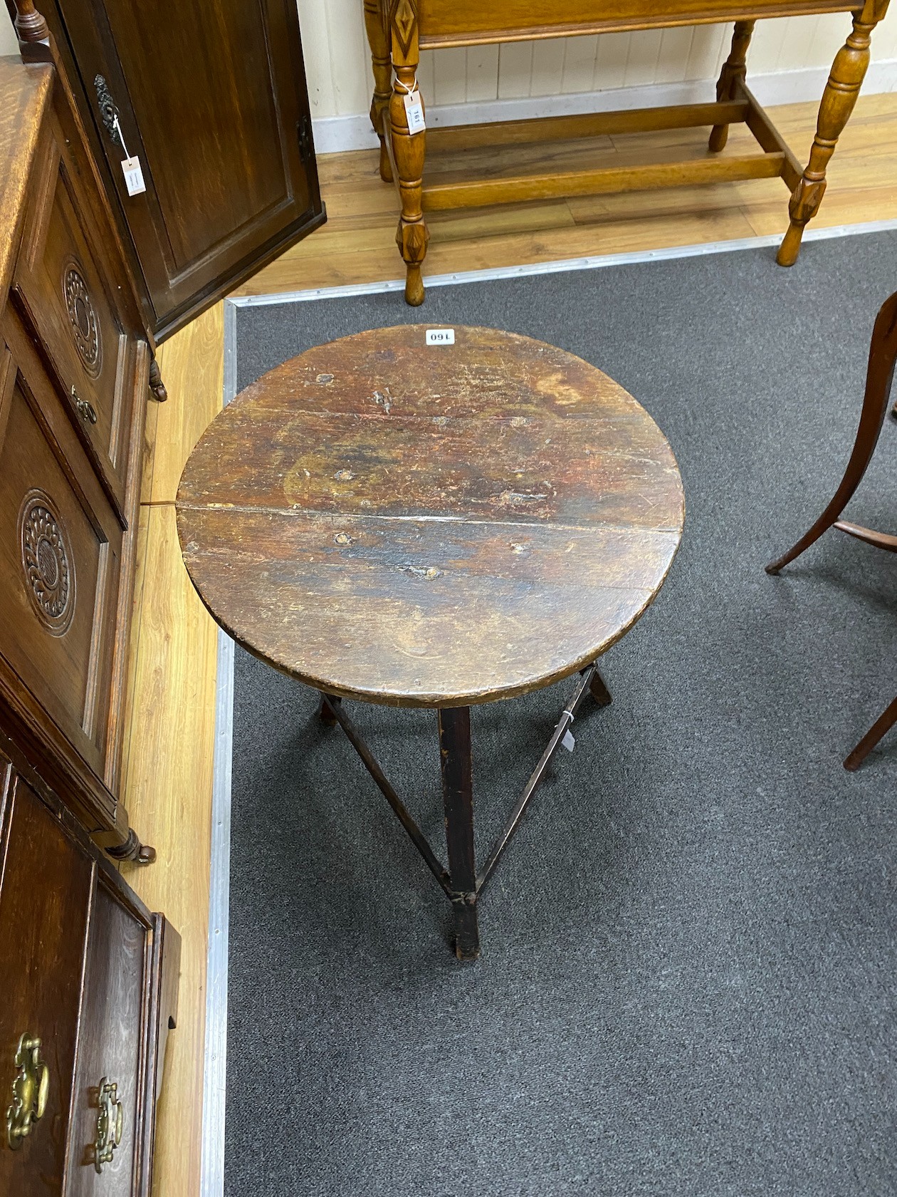 A 19th century circular primitive cricket table, diameter 49cm, height 71cm